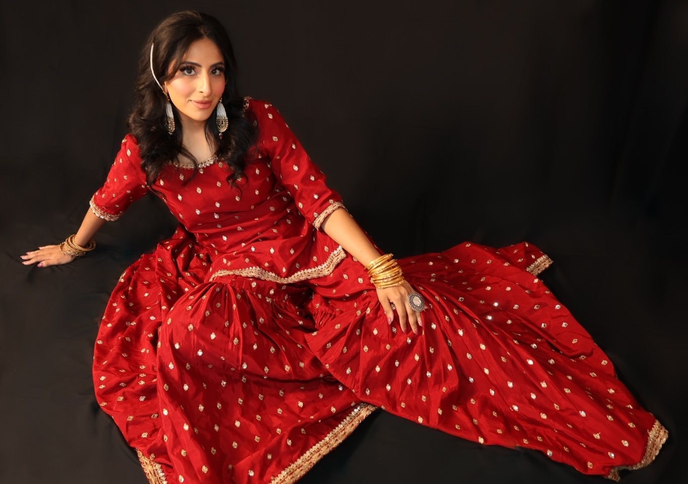Full-length editorial portrait, seated