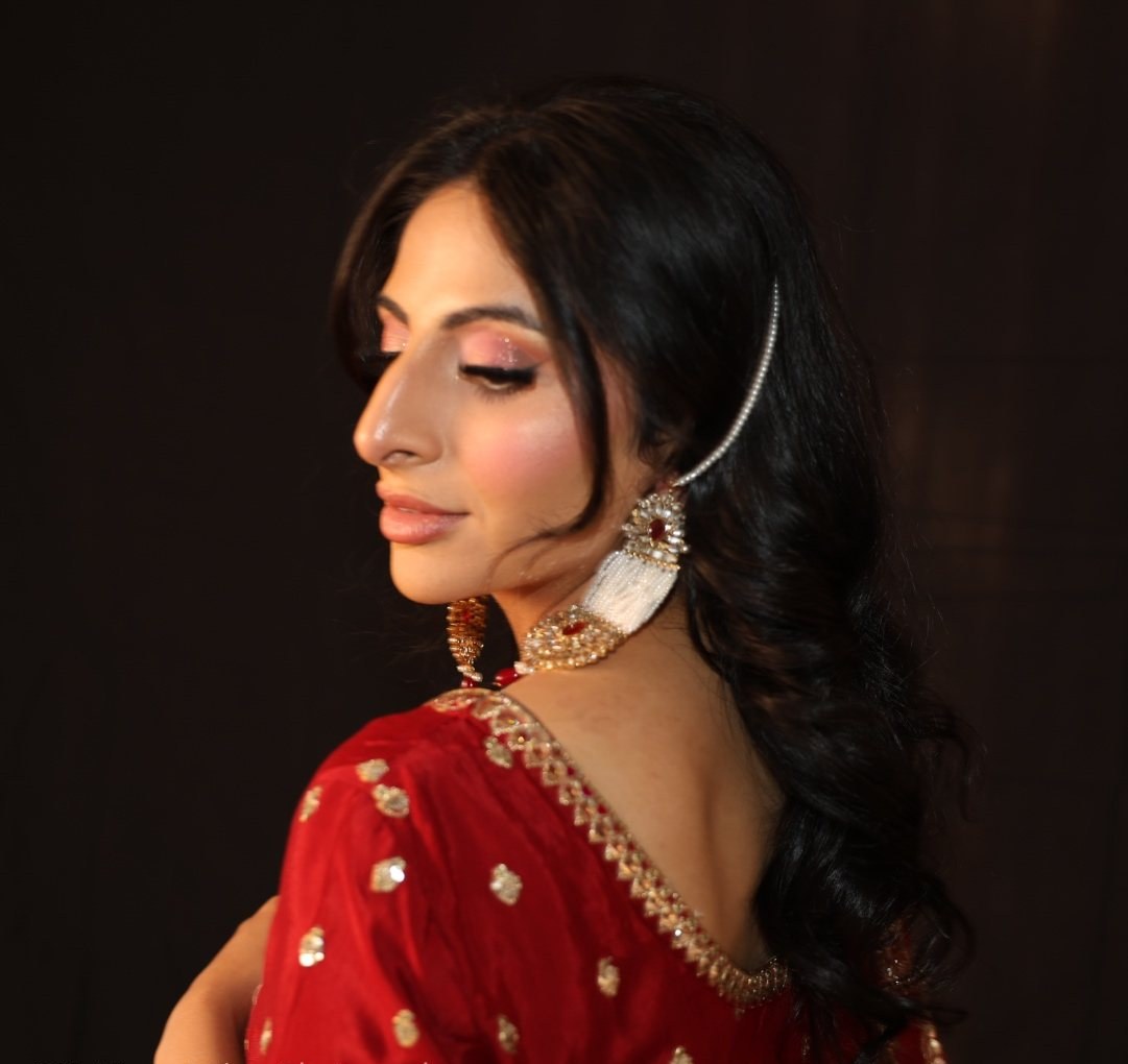 Profile portrait against a dark backdrop
