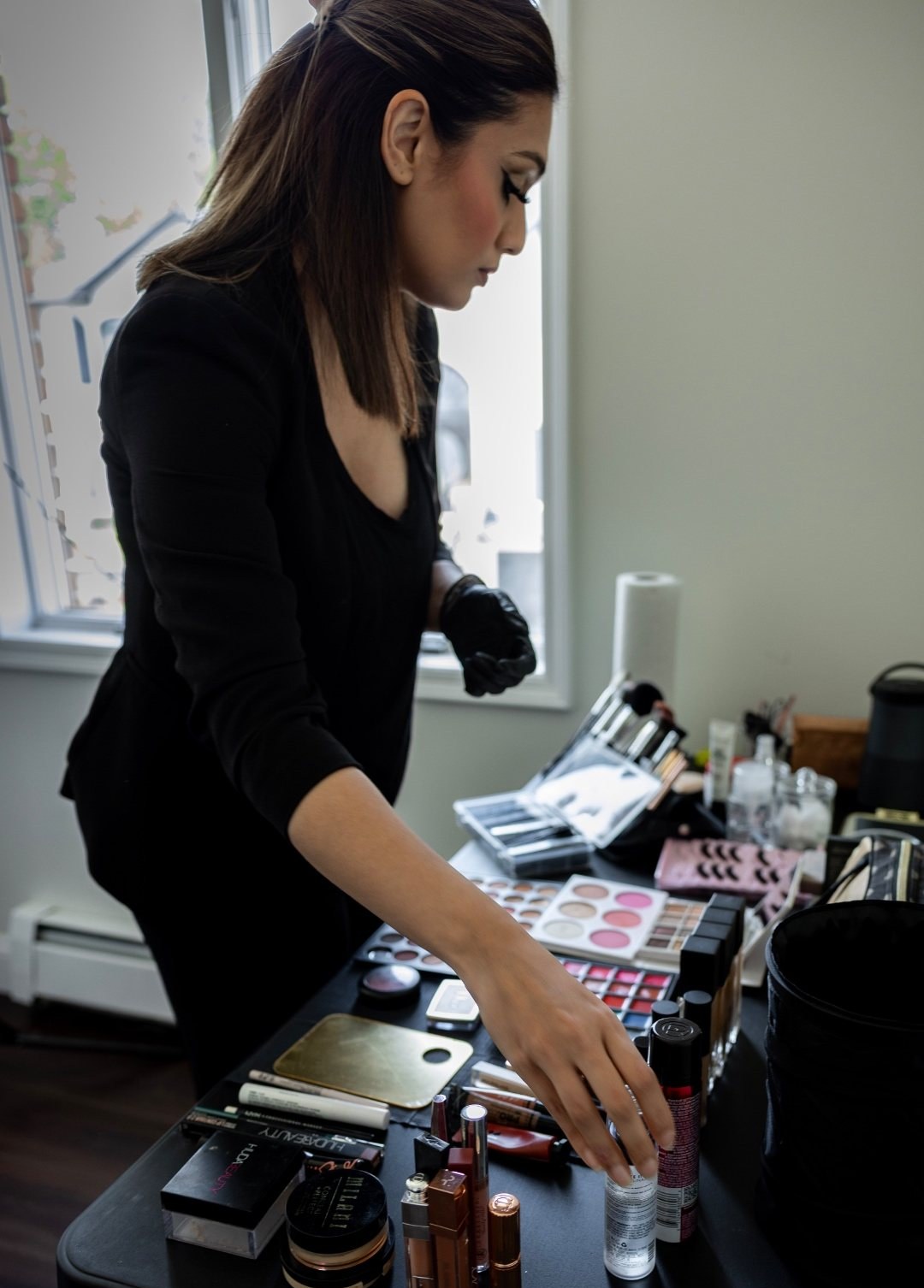 An artist working through her kit during a shoot
